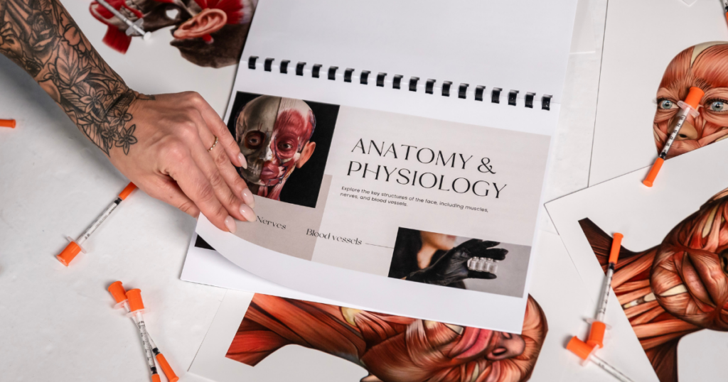 Lindsay turning the page of a physiology textbook. for assessment-driven injector training.